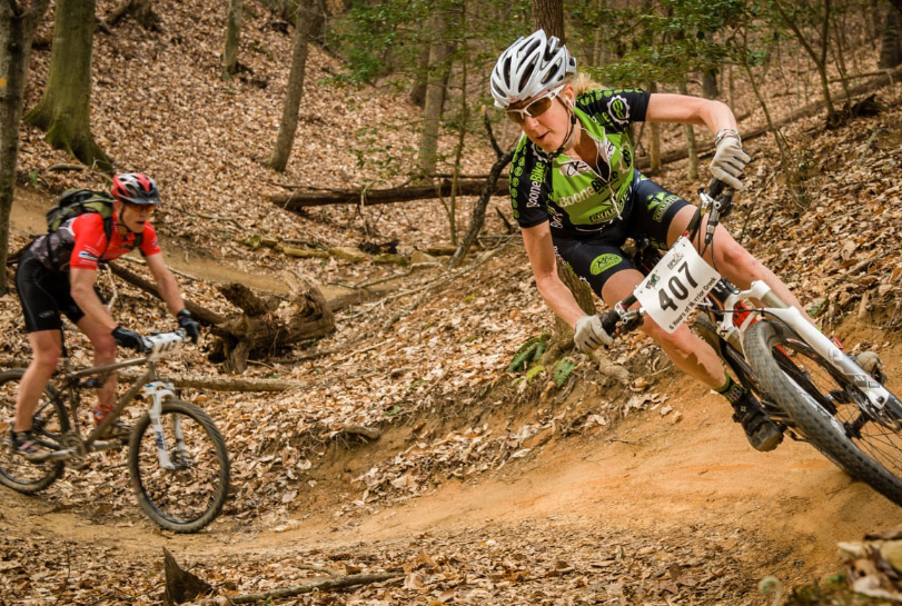 2 people riding mountain bikes